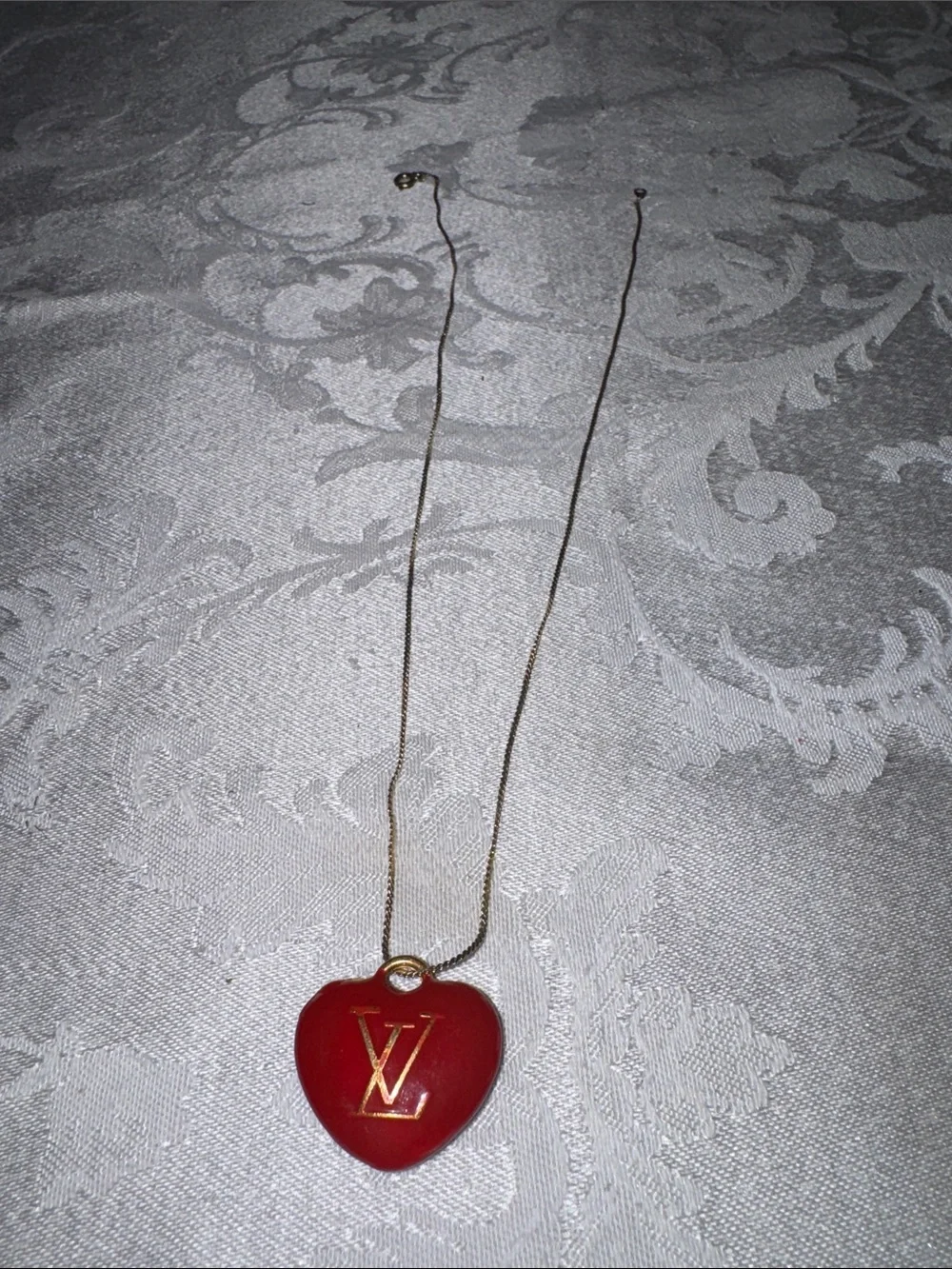 Louis Vuitton Gold-Tone Chain with Red Heart LV Pendant